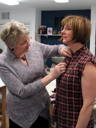 Jane does a fitting on Barb's couture jacket. 
